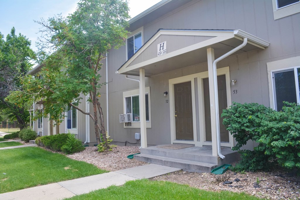 the front of a house with steps and a porch