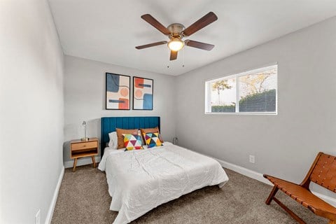 Bedroom Ceiling Fan and light with cozy bed at Balfour East Lake, Atlanta