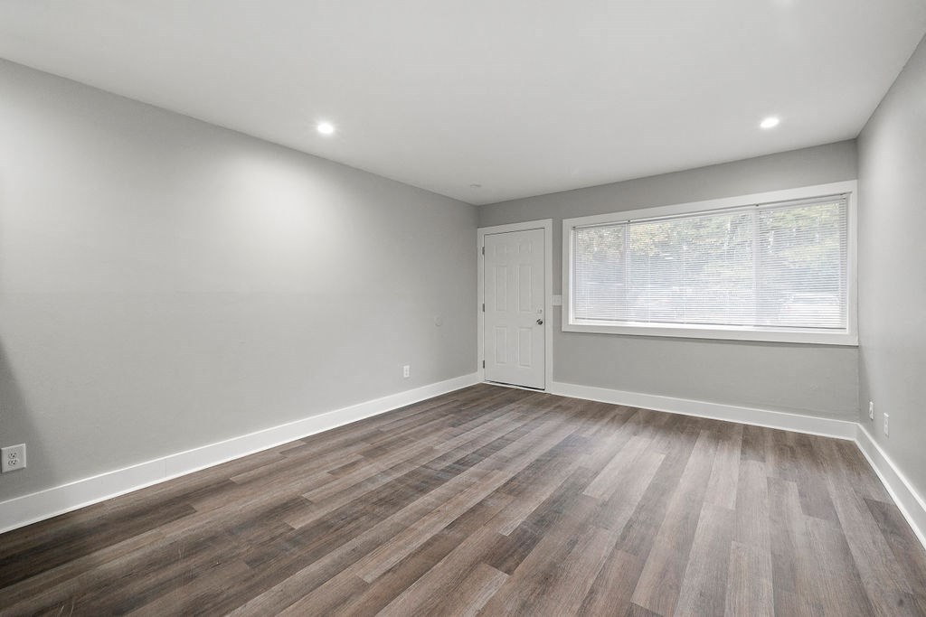 Renovated Living Room New Flooring Upgraded Light Fixtures at Balfour Chastain, Georgia, 30342