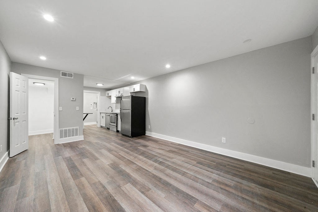 Renovated Living Room New Flooring Upgraded Light Fixtures at Balfour Chastain, Sandy Springs, GA, 30342