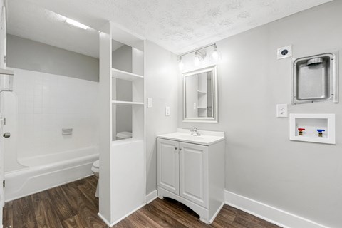 Bathroom with washer and dryer Bathroom with washer and dryer connections at Balfour Chastain, Sandy Springs, GA