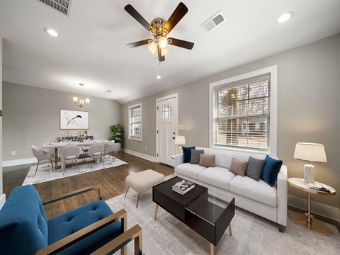 a living room with a couch and a table
