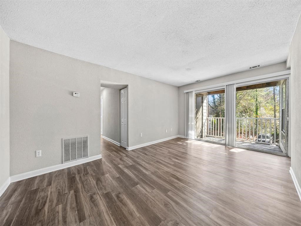 Cozy living room with new flooring and natural light.  at Concord Crossing, Smyrna, Georgia