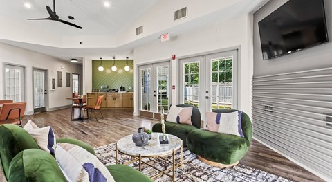 A living room with a green couch and a coffee table.