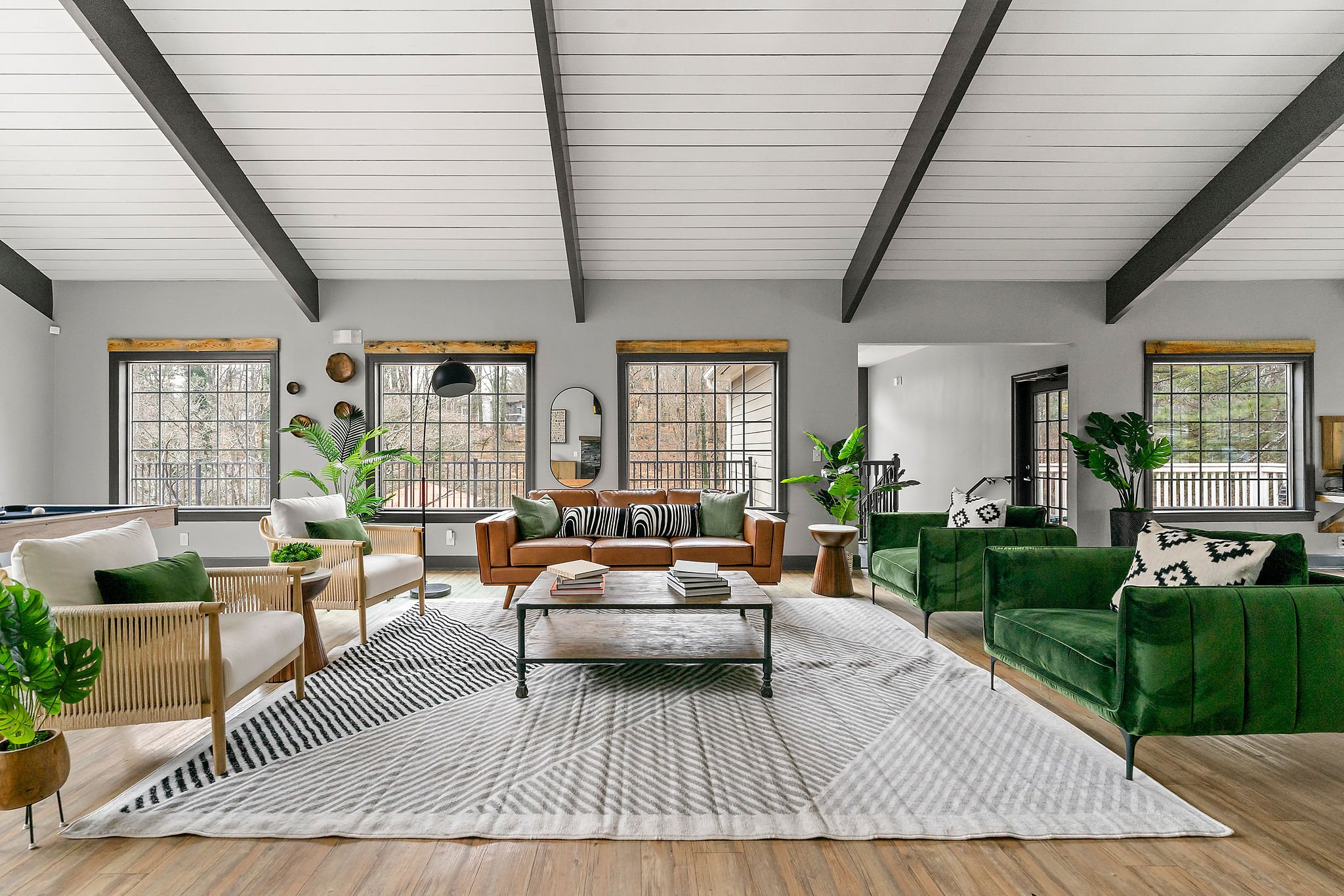 A living room with a green couch and a coffee table.