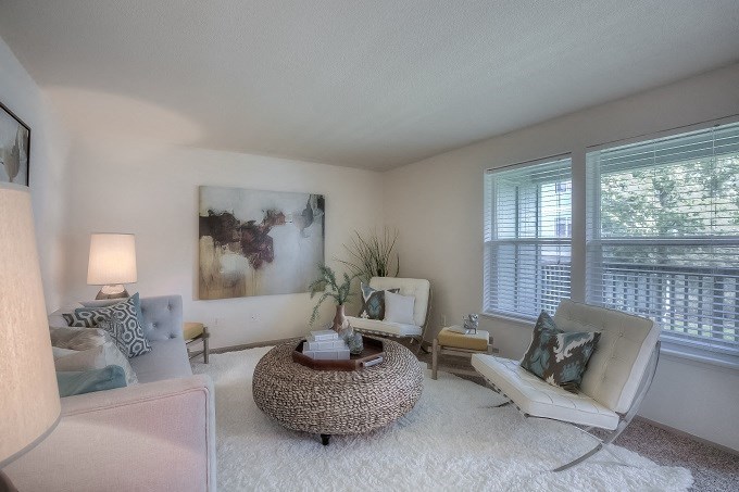 Living Room Area with Plush White Area Rug and View of Balcony at Parkside Apartments, Gresham