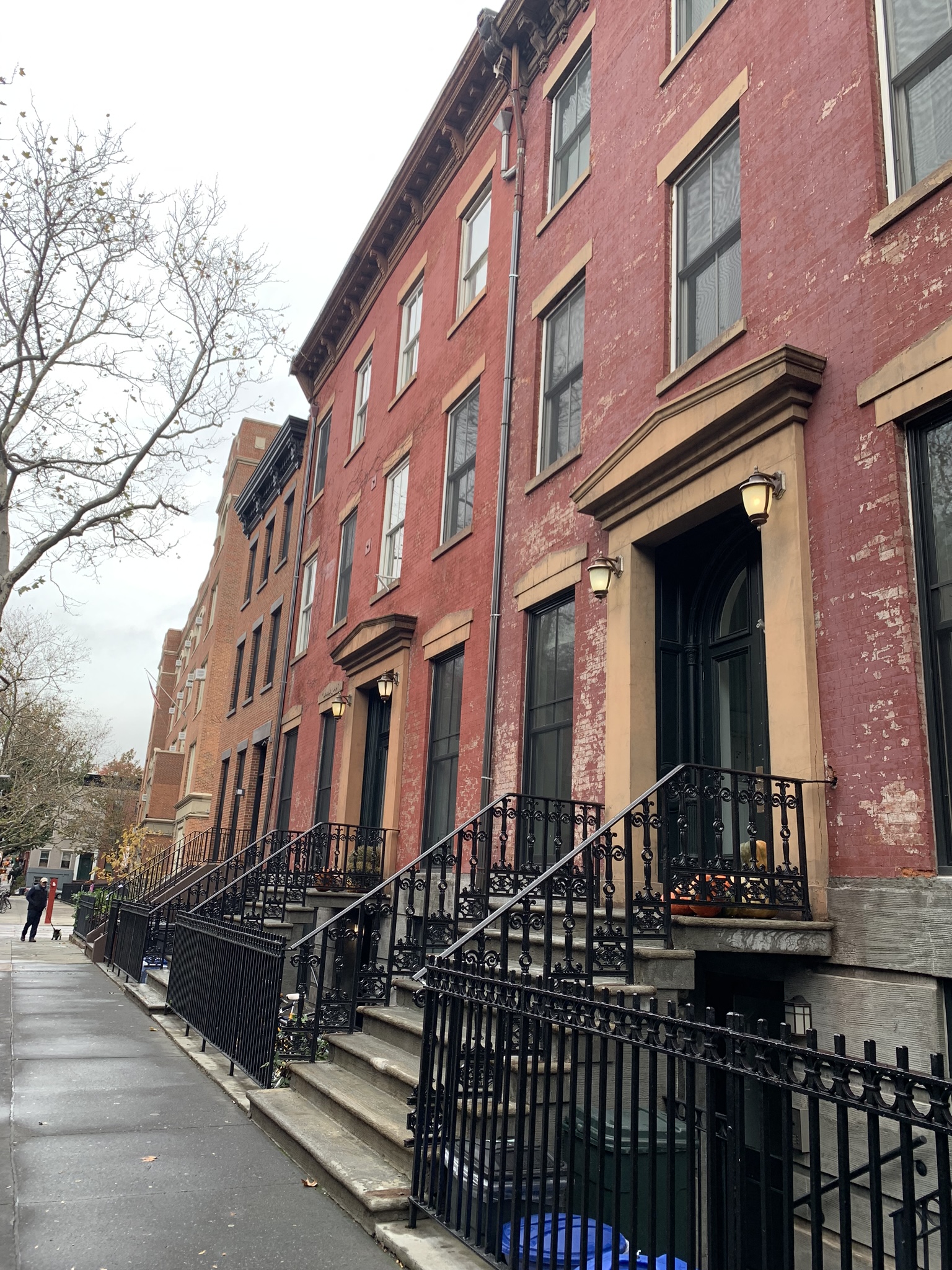 a row of red brick buildings on a city street