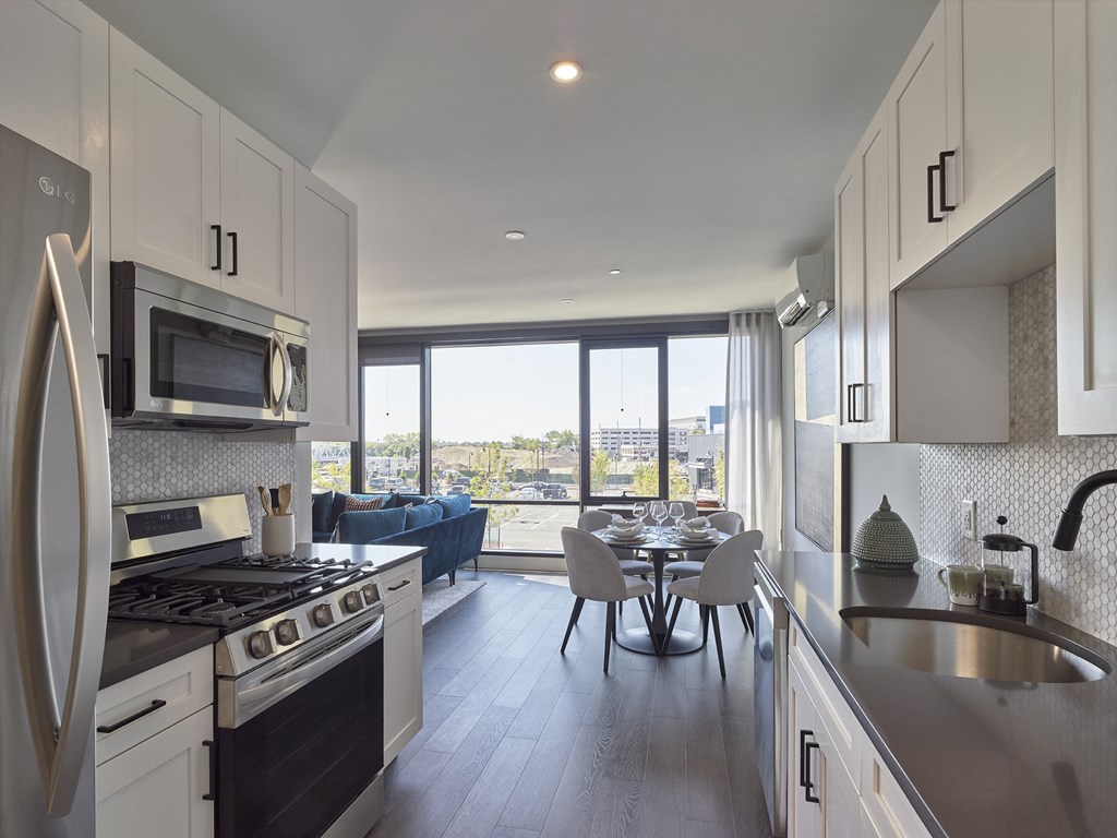 open floorplan, spacious one bed, hardwood flooring, stainless steel appliances, floor to ceiling windows