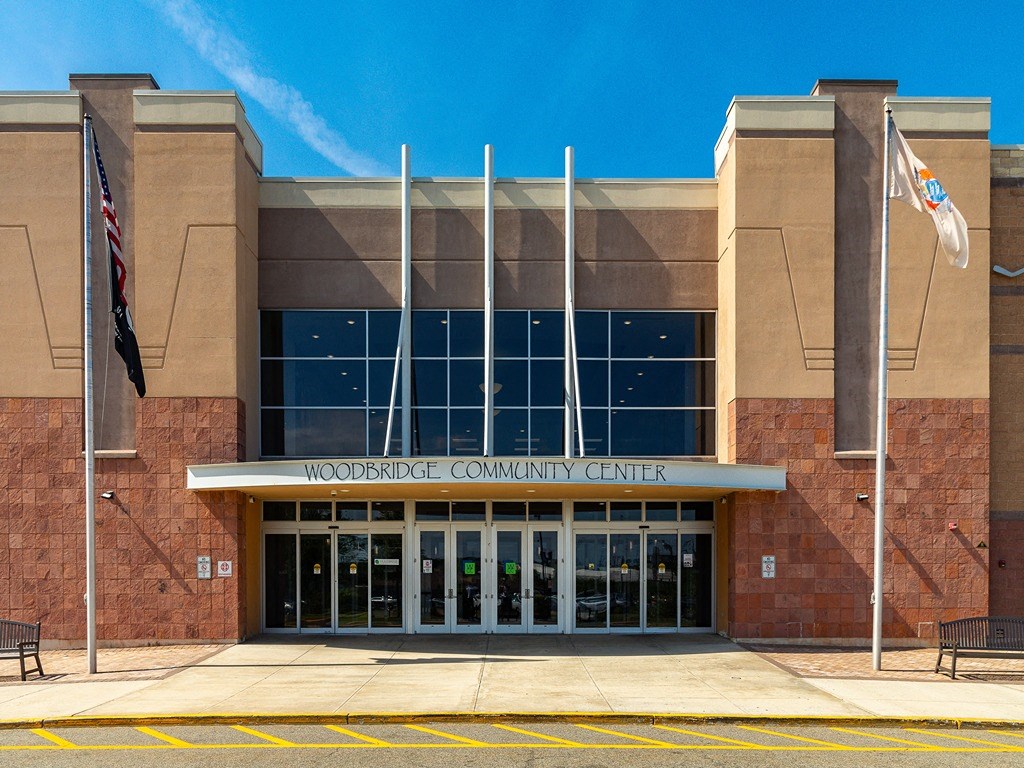 the front of the independence community center building with flags
