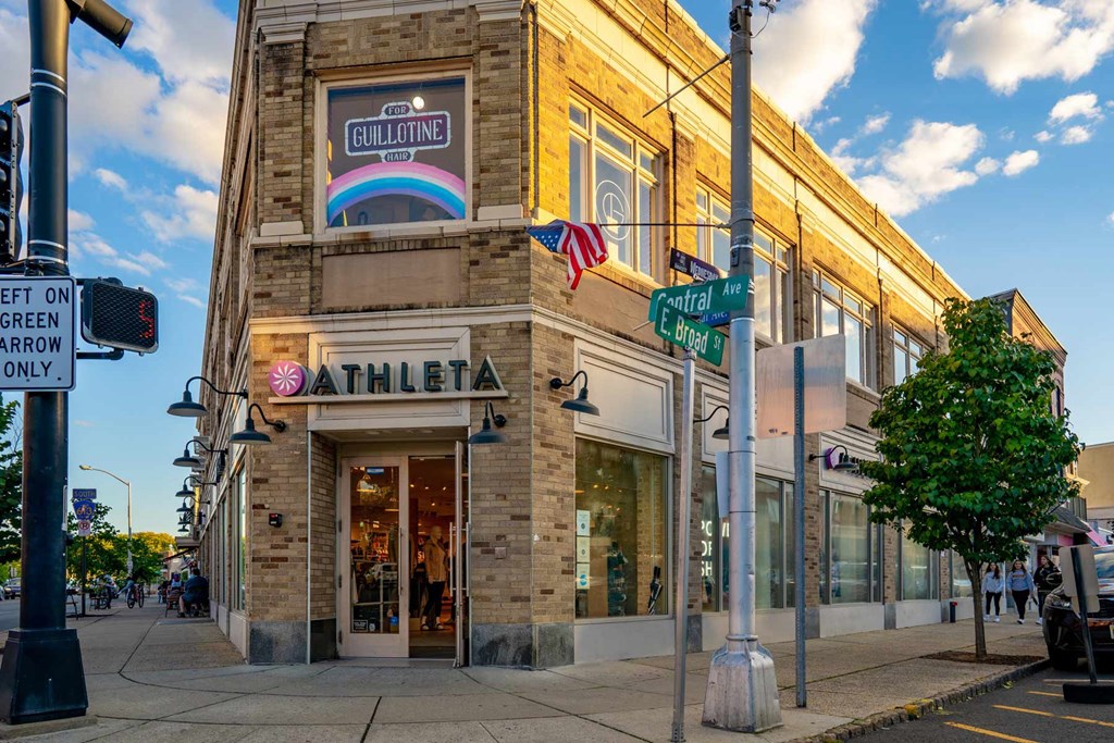 A storefront with a sign that says "ATHLETIC" is visible.