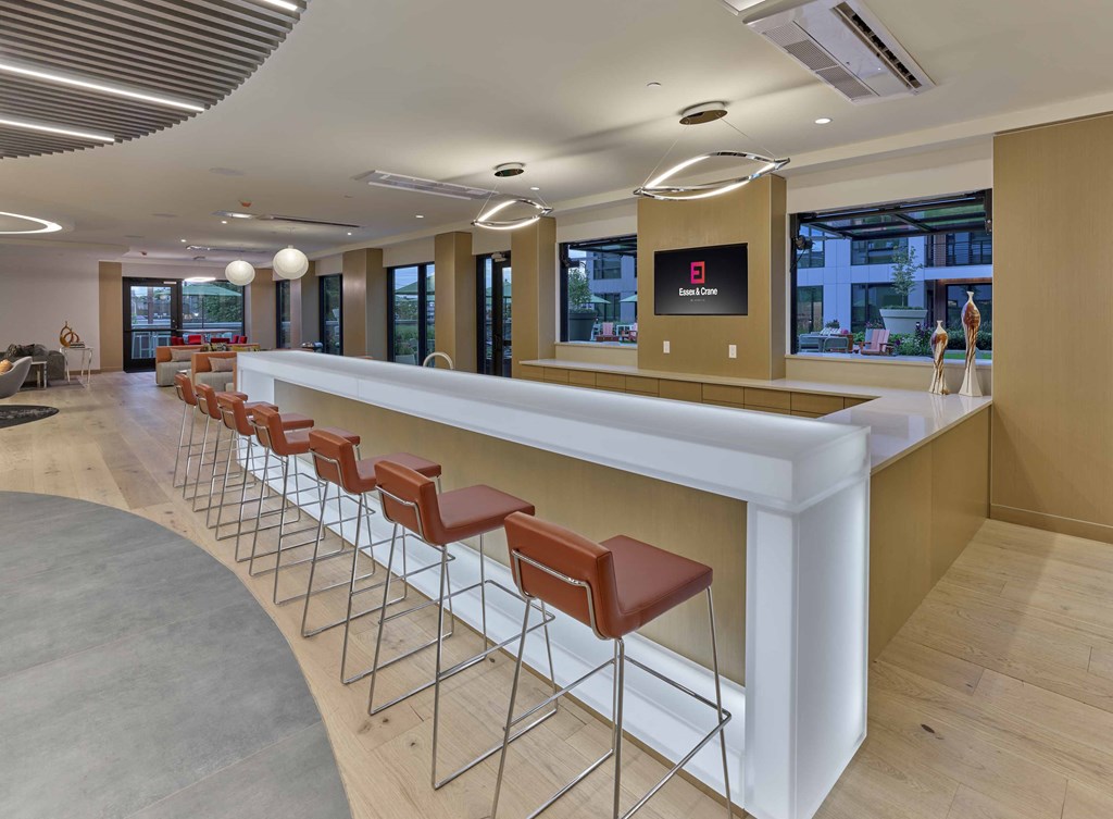 resident clubroom, indoor outdoor amenities, bar area, pool tables, lounge seating