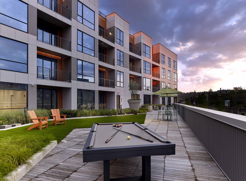 luxury apartments, outdoor pool table, outdoor lounge,