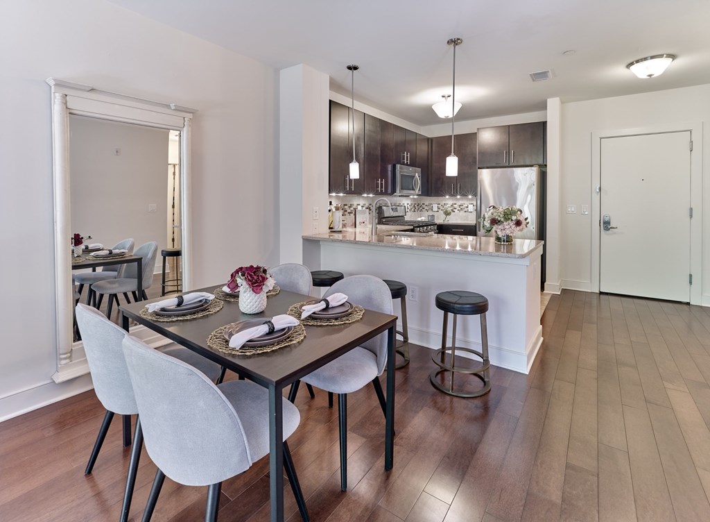 Interiors A modern dining room with a wooden table and white chairs.