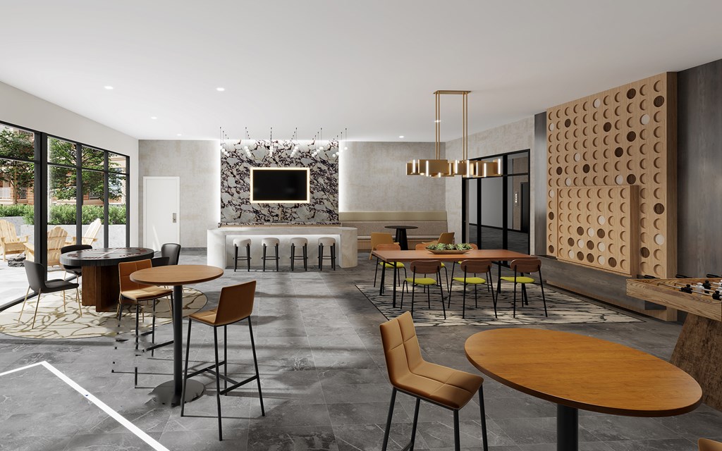 Amenities A modern dining room with a stone wall and wooden tables.