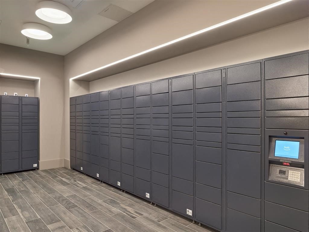 A row of black lockers in a room.