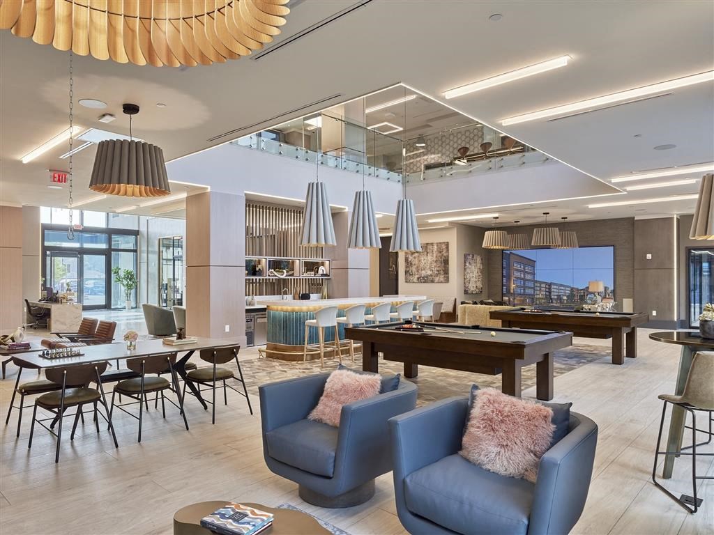 A modern living room with a large window and a view of the city.