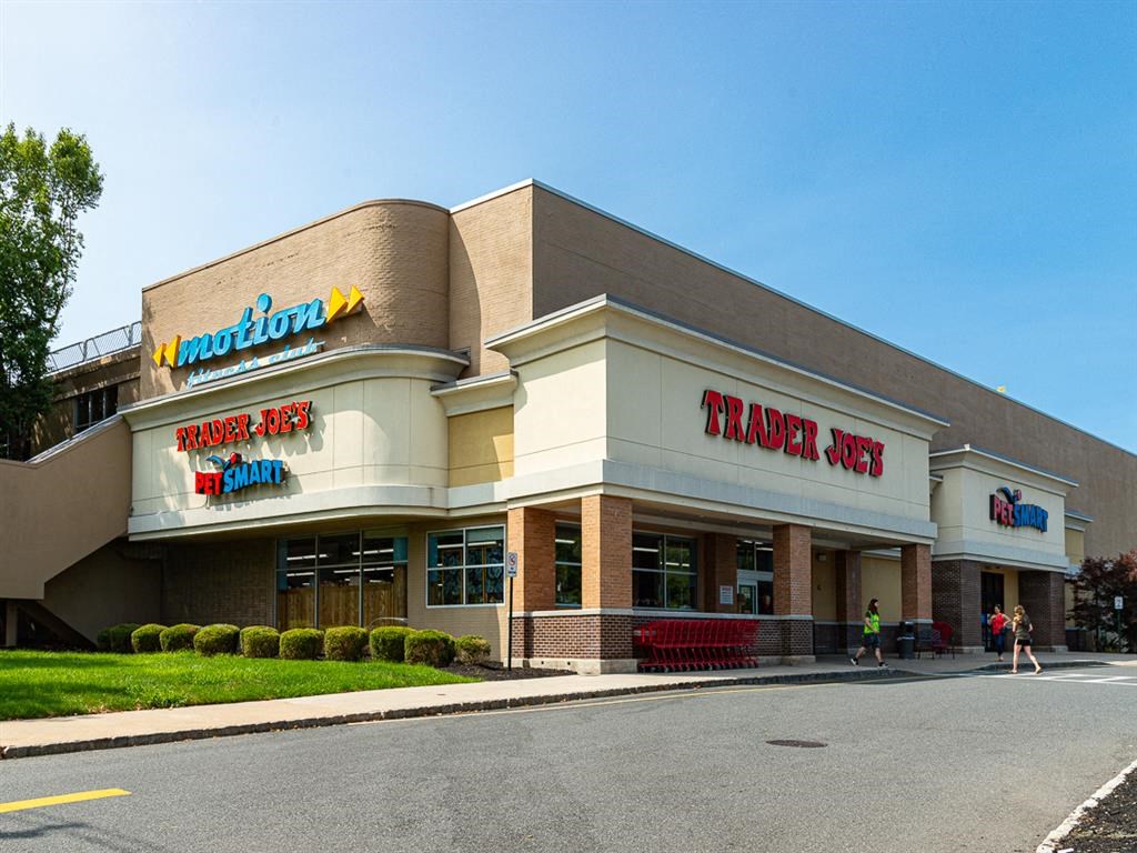 the front of a trader joes restaurant on the side of a road