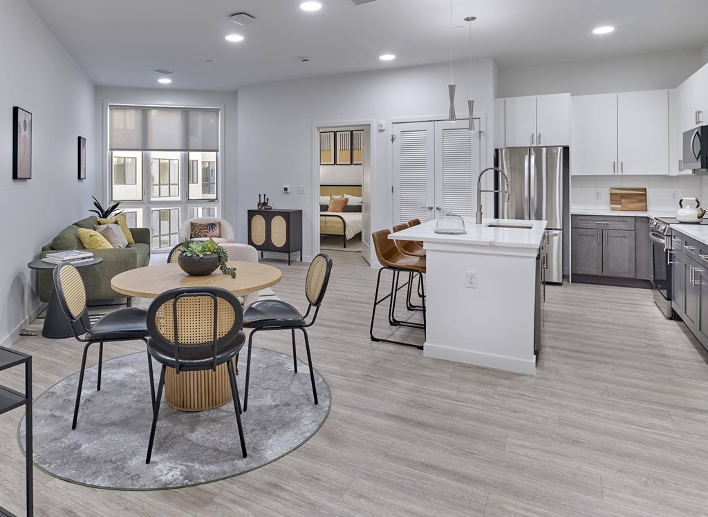 Residences Kitchen with bar seating and stainless steel appliances in Ora luxury apartments in Hackensack, NJ