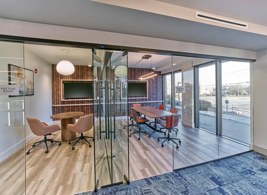 Resident lounge with vibrant seating and communal space at Ora luxury apartments in Hackensack, NJ