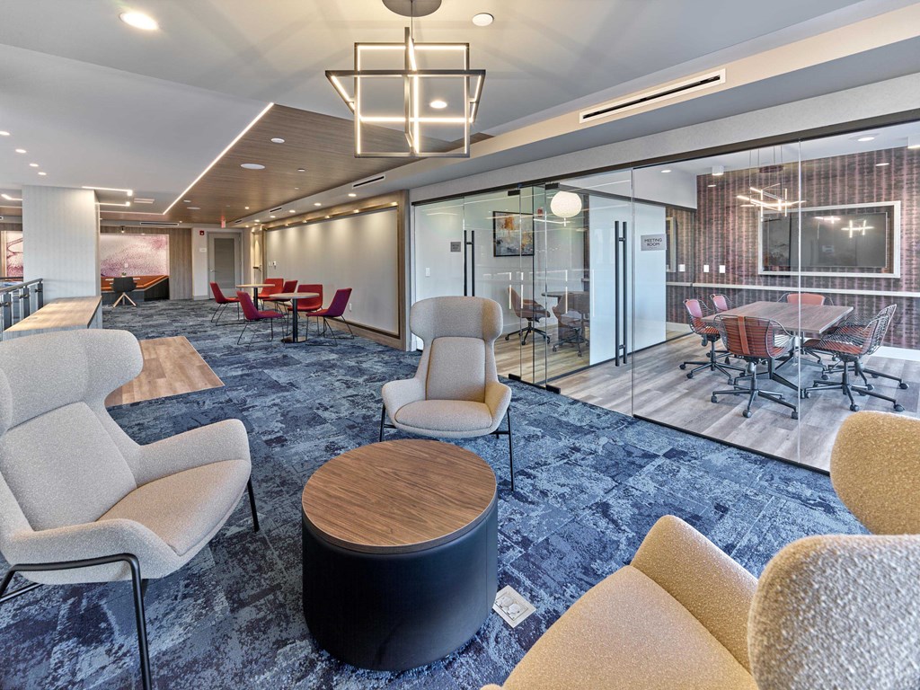 Resident lounge with stylish seating, a fireplace, and cozy ambiance at Ora in Hackensack, NJ