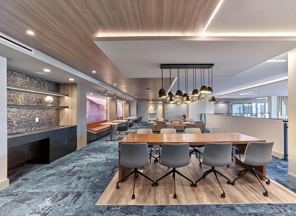 Dining area with sleek table and designer lighting at Ora in Hackensack, NJ