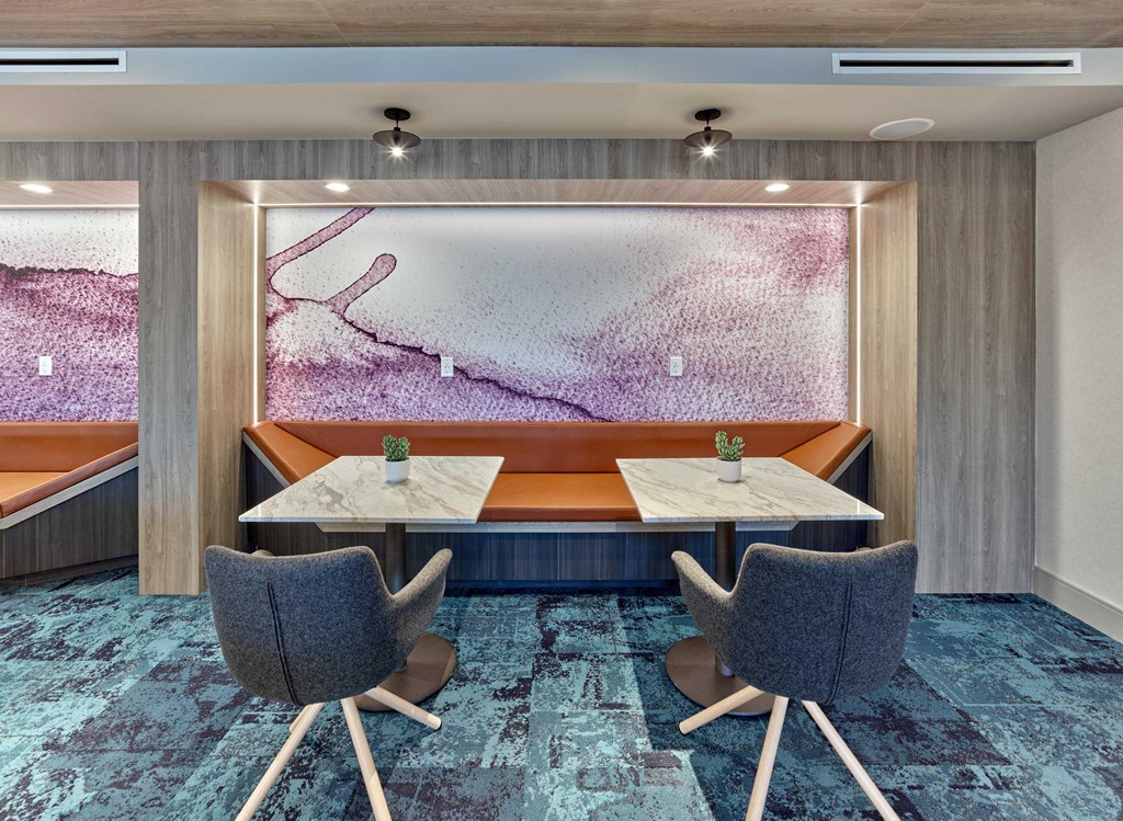 Resident meeting room with large conference table and sleek design at Ora in Hackensack, NJ