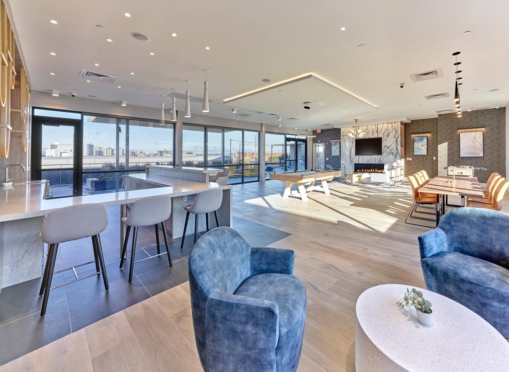 Resident communal space with modern furnishings and scenic views at Ora luxury apartments in Hackensack, NJ