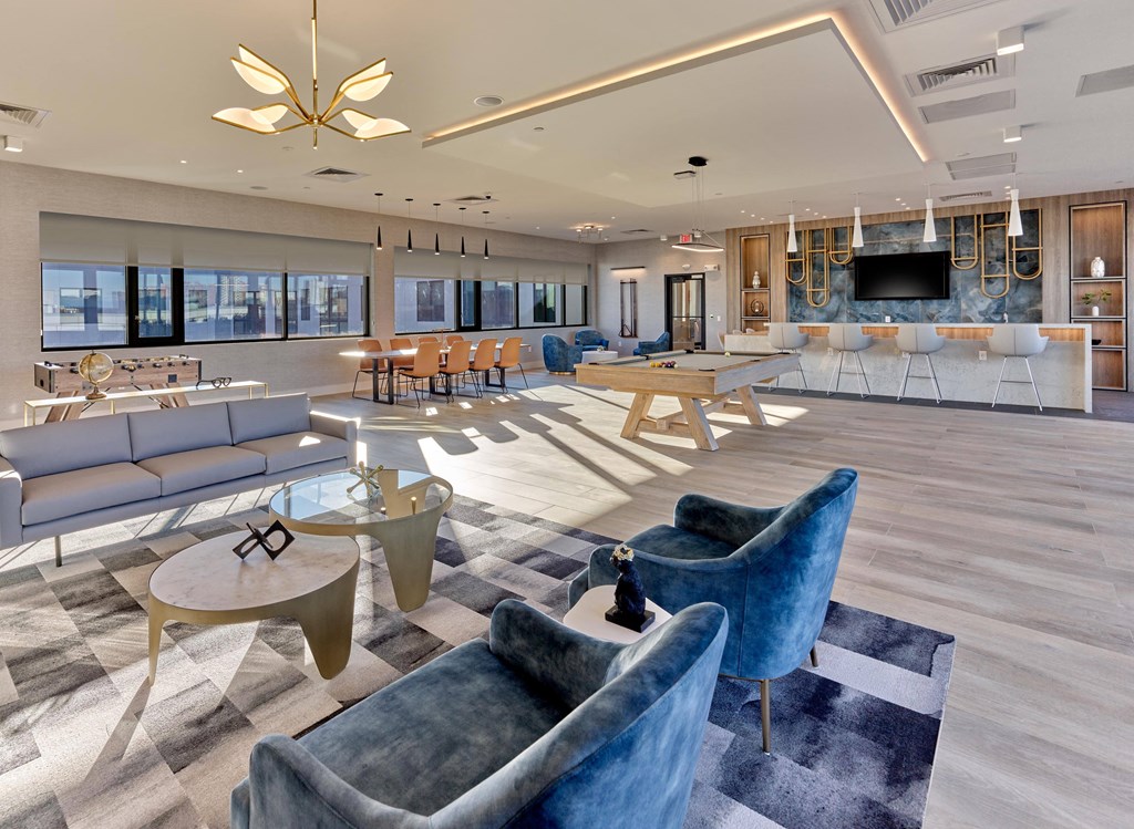 Spacious resident lounge with modern seating and natural light at Ora luxury apartments in Hackensack, NJ