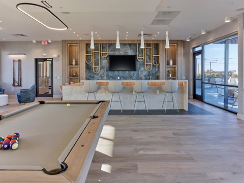 Recreational lounge area with a pool table and communal space at Ora luxury apartments in Hackensack, NJ
