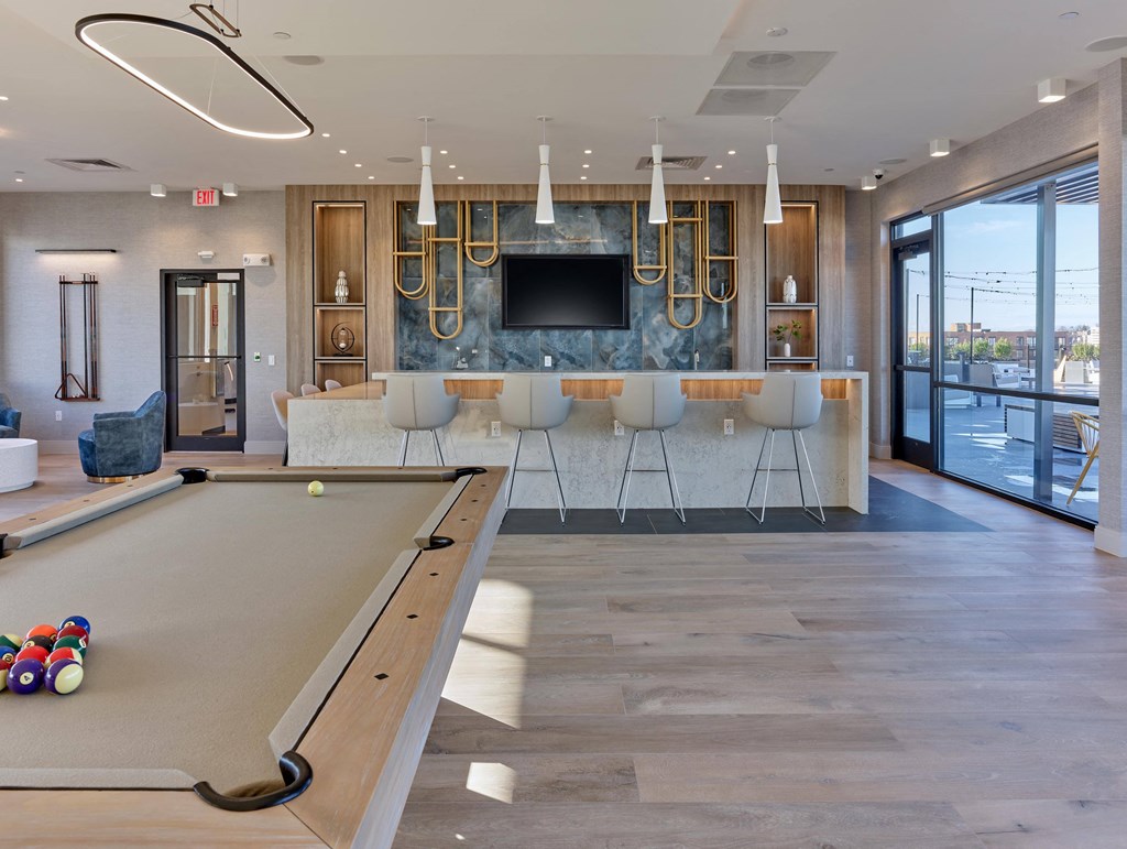 Amenities Recreational lounge area with a pool table and communal space at Ora luxury apartments in Hackensack, NJ