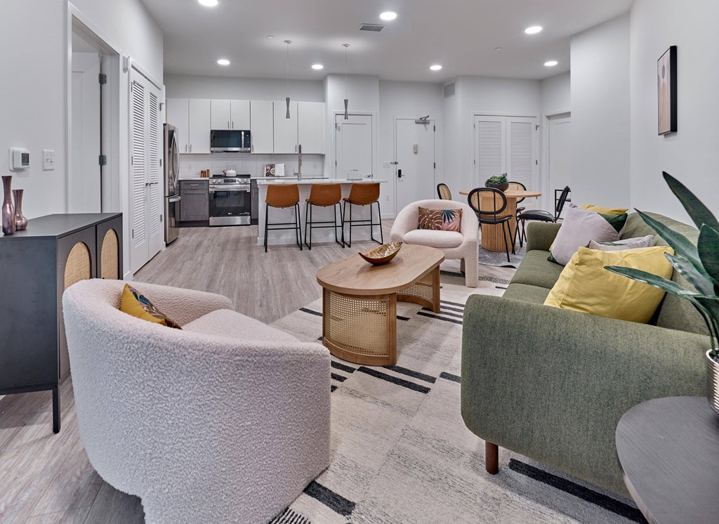 Spacious living room with neutral-toned decor and inviting seating at Ora in Hackensack, NJ