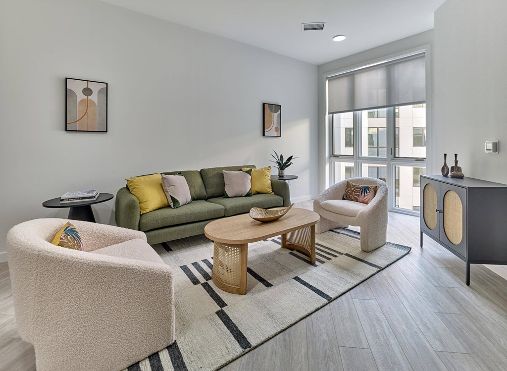 Luxury apartment with open living and dining space, modern decor, and natural light at Ora in Hackensack, NJ