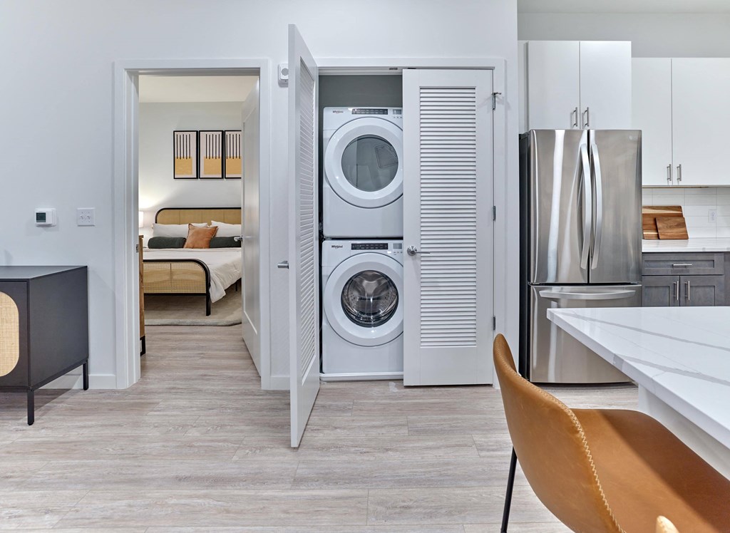 In-unit washer and dryer in a sleek laundry space at Ora luxury apartments in Hackensack, NJ