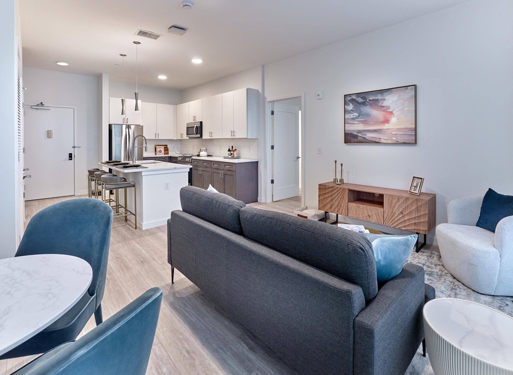Open-concept living room with modern furniture and natural light at Ora luxury apartments in Hackensack, NJ