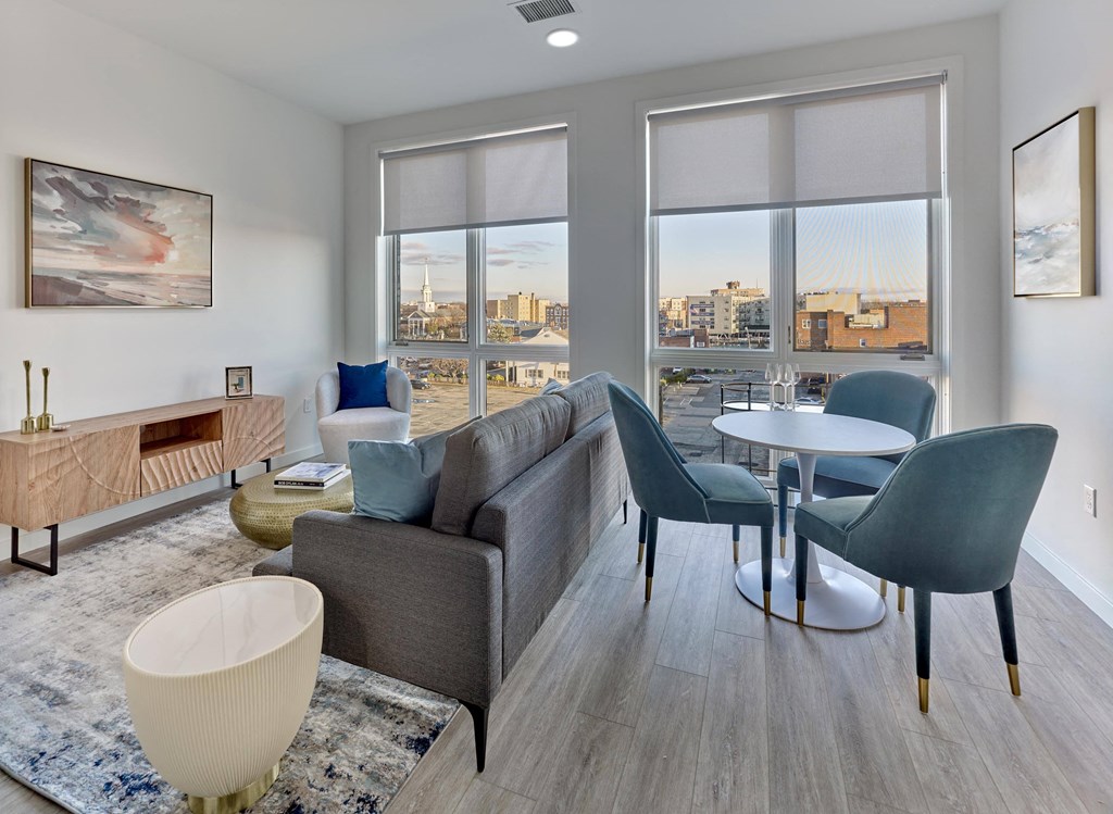 Open-concept dining and living area with natural light at Ora luxury apartments in Hackensack, NJ