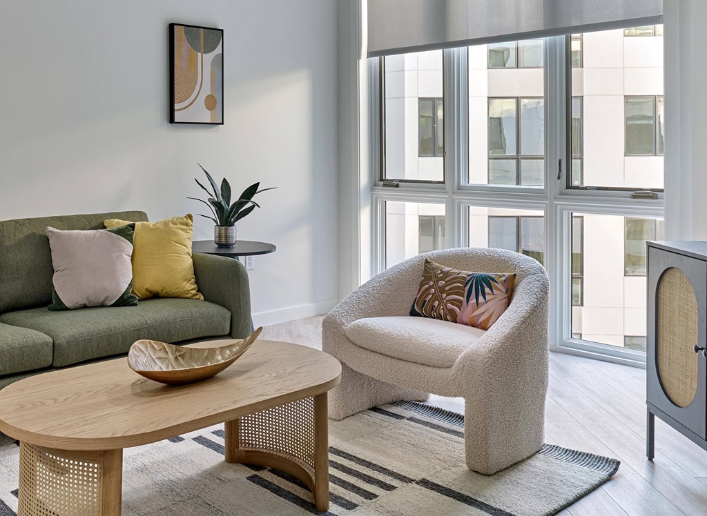 Outdoor seating area with lush greenery and stylish furniture at Ora luxury apartments in Hackensack, NJ