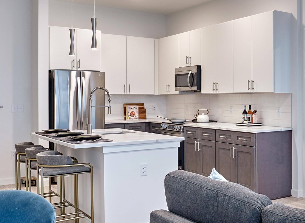 Modern kitchen with sleek cabinetry and stainless steel appliances at Ora luxury apartments in Hackensack, NJ