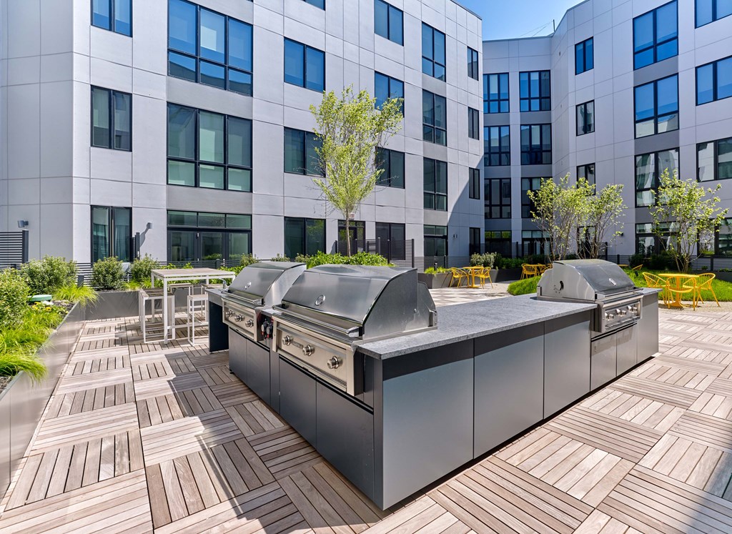 A modern building with a large outdoor kitchen area.