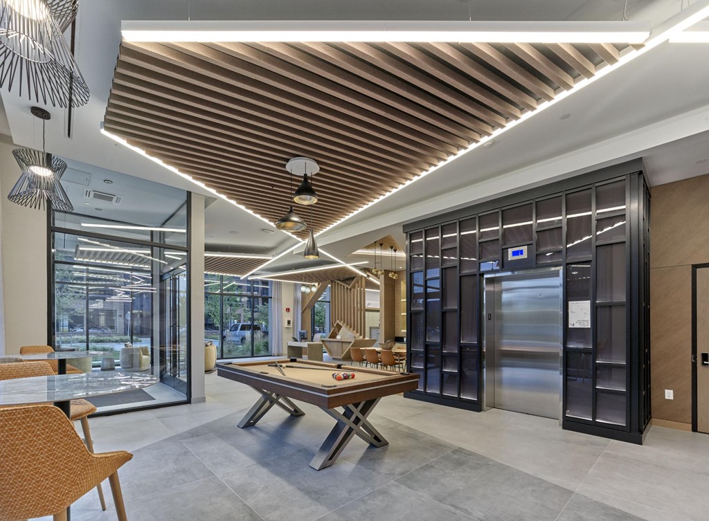 Modern resident lounge with a game room at Print House Apartments, Hackensack, NJ