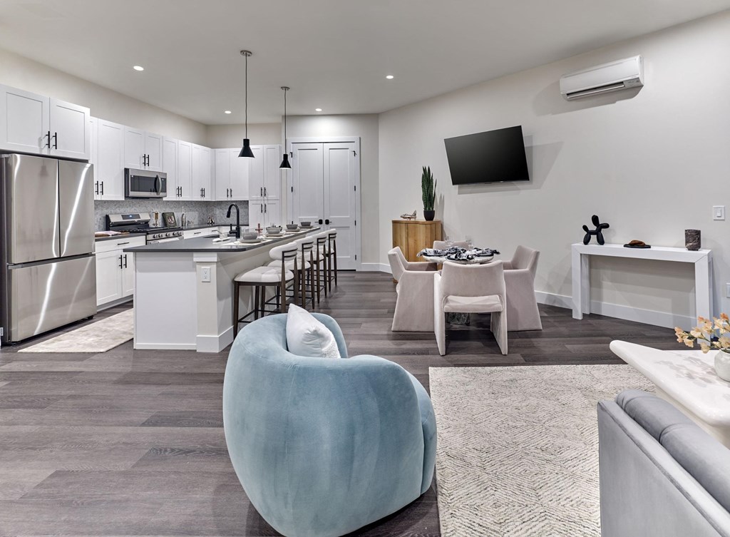 Open-concept living and dining area in a Print House Apartments unit, Hackensack, NJ