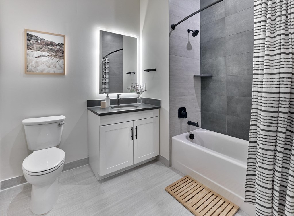 Modern bathroom with spa-like shower/tub with sleek finishes at Print House, Hackensack NJ
