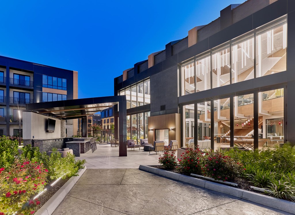 A modern building with a courtyard and plants.