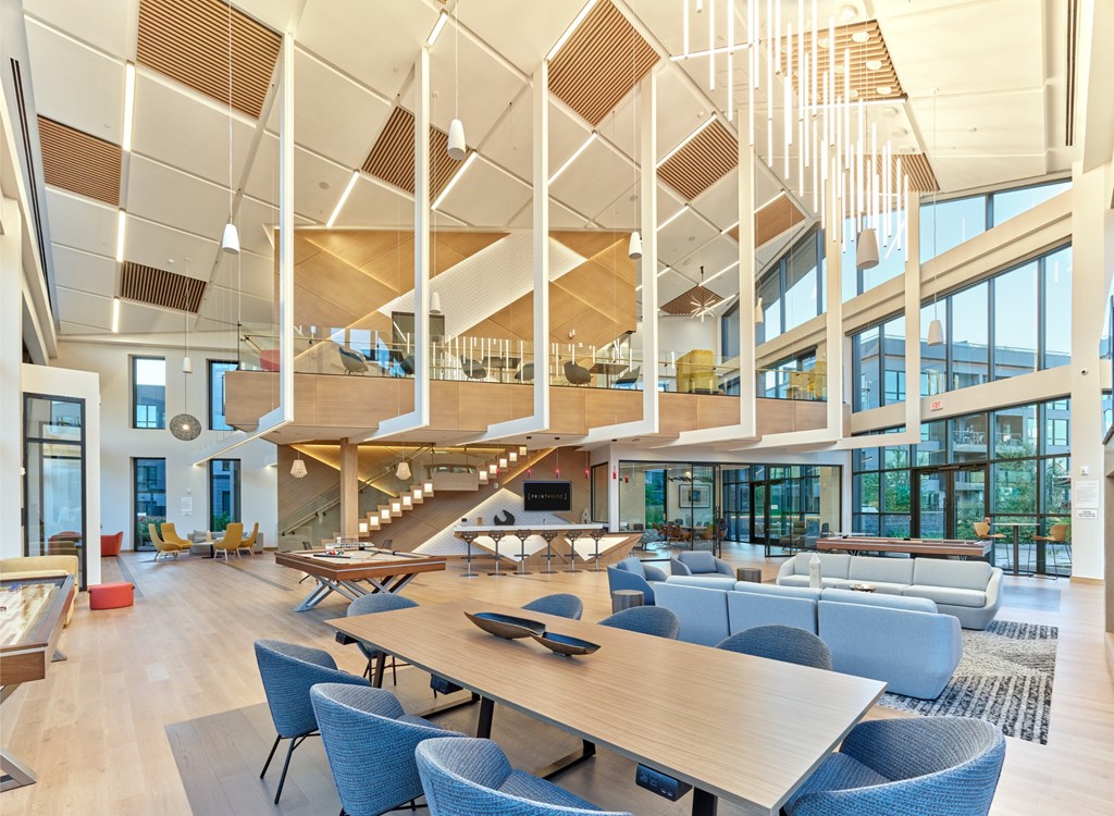 A modern open space with a long table and chairs.