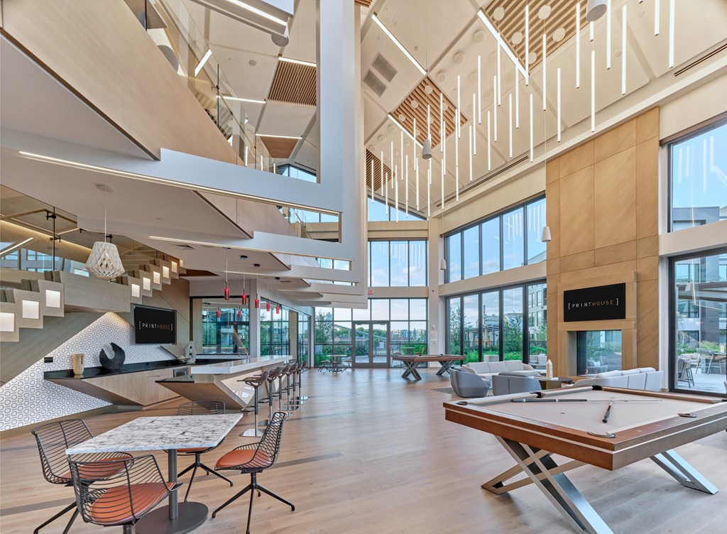A modern open space with a long table and chairs.
