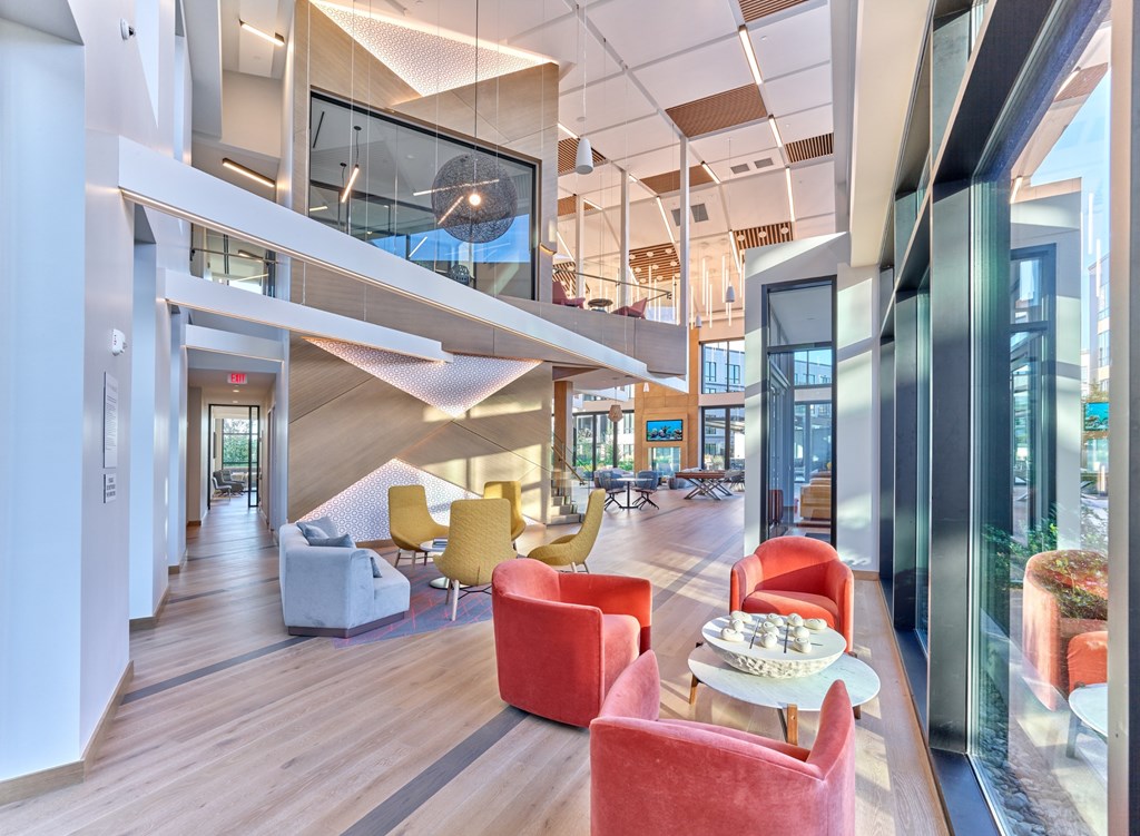 A modern interior with a glass ceiling and a staircase.