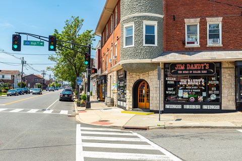 A street view with a restaurant named Jim Dandy's on the corner.
