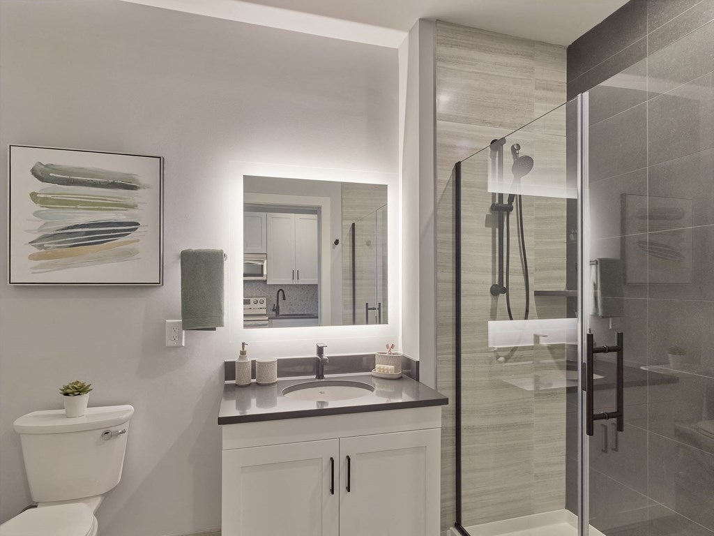 large bathroom, glass shower door, tiled bathroom