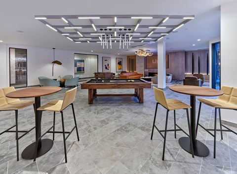 Club room with game tables, lounge and table seating, private resident club room