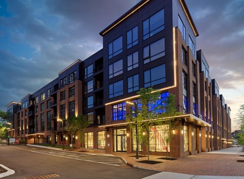 a building on a city street at dusk