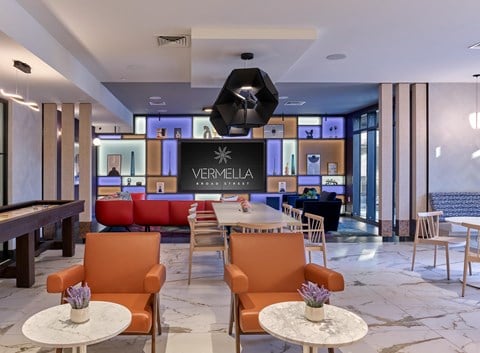 clubroom, lounge, resident amenity space, bar area, fireplace, game tables, media wall